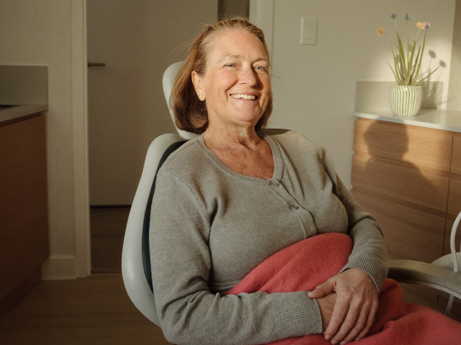 Relaxed patient smiling at a healing check-in visit